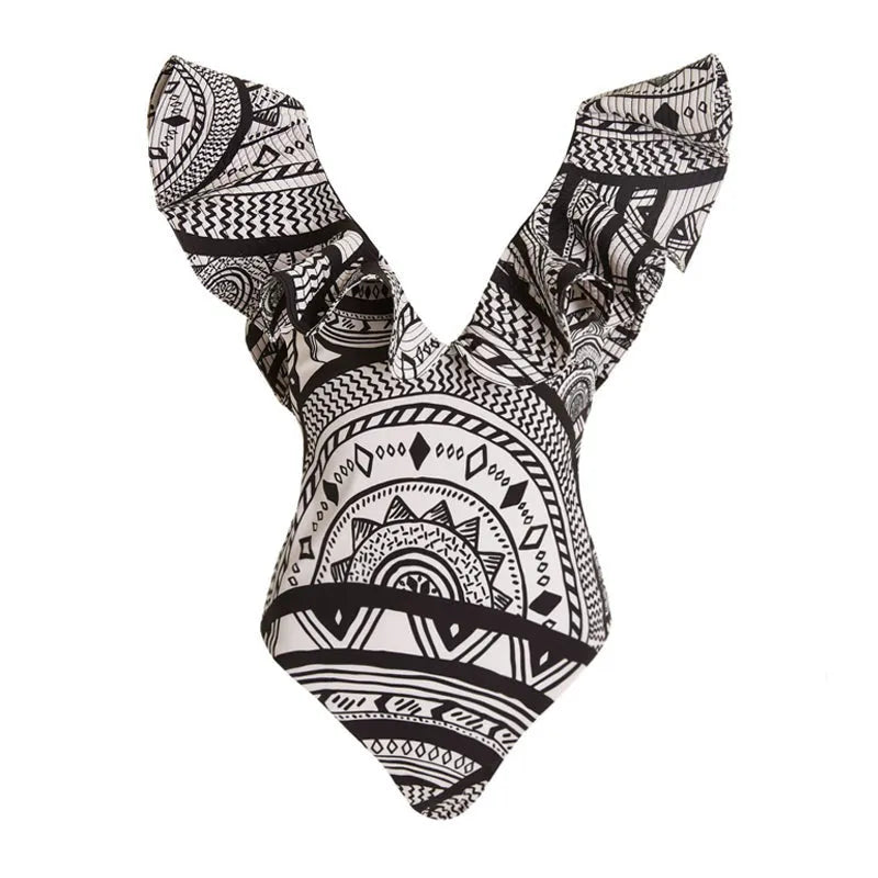 Women's vintage print one-piece swimsuit with deep V-neck, ruffles, and a matching wrap skirt.