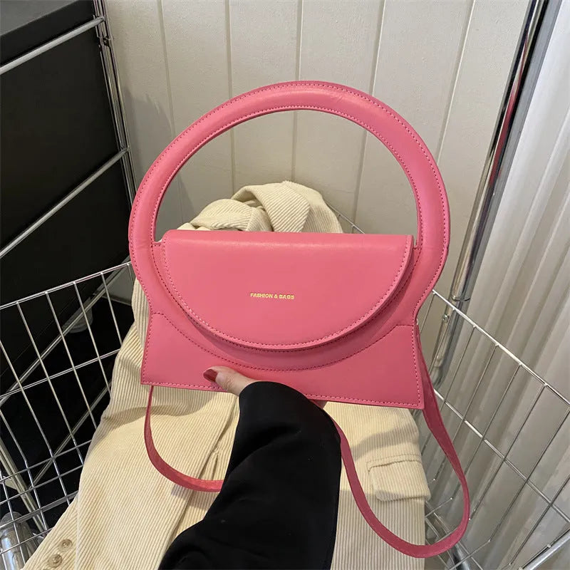 PU leather messenger bag in horizontal square shape with sandwich pockets and stitching details