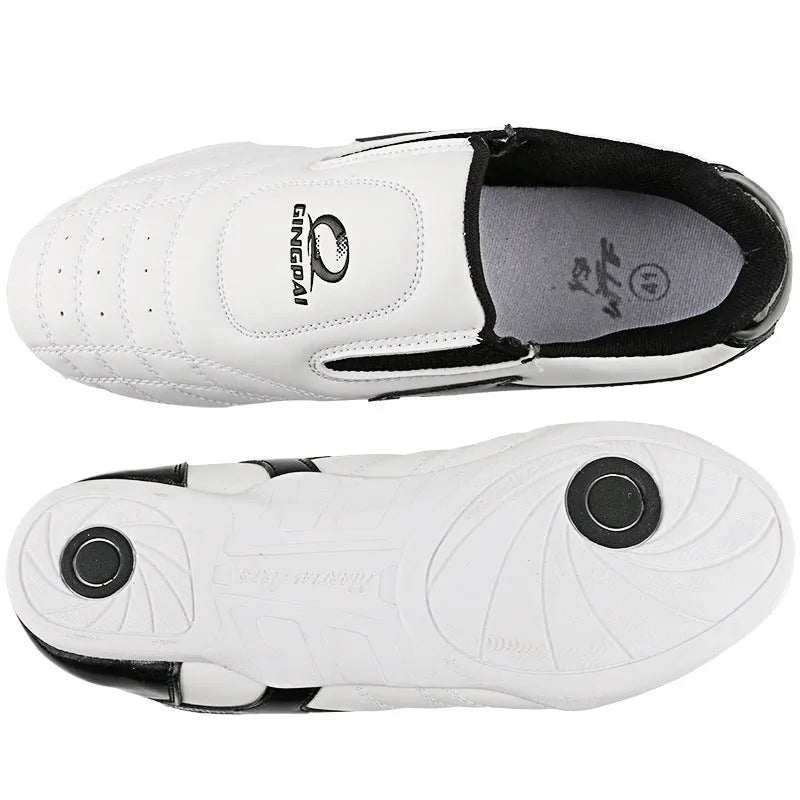 Black and white children's martial arts training shoes with a soft sole and widened design.