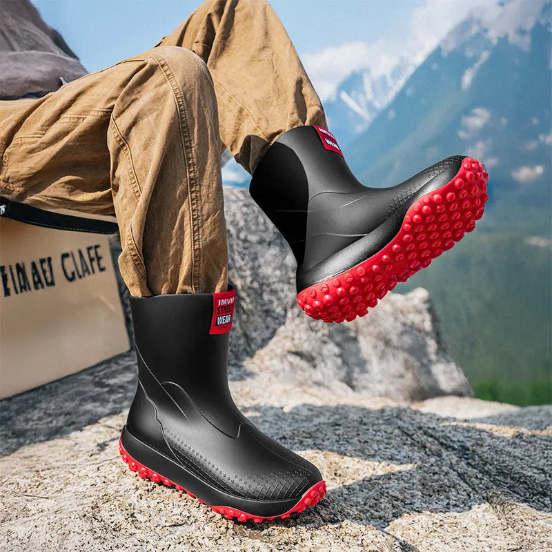 Men's mid and low tube rain boots in black, waterproof PVC with non-slip plastic sole on wet ground