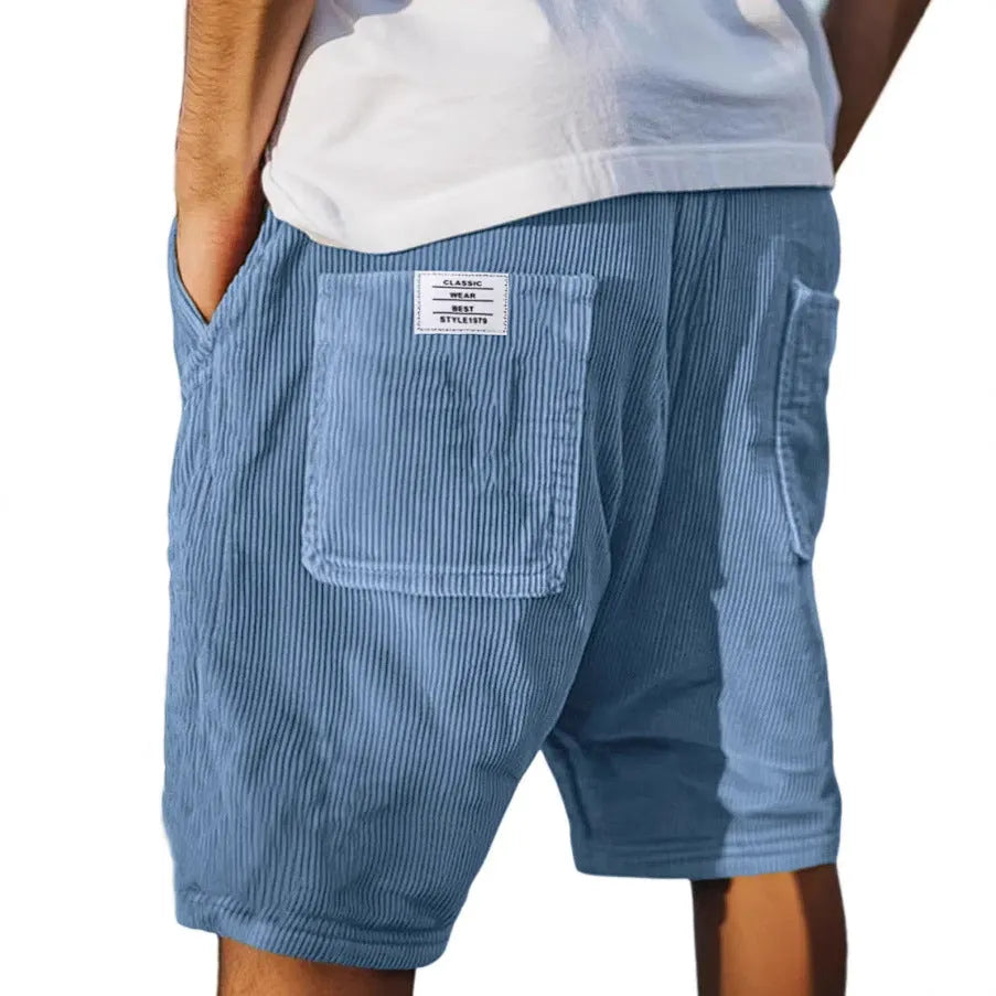 Men's grey corduroy shorts with multiple pockets and straight-leg cut on a neutral background.