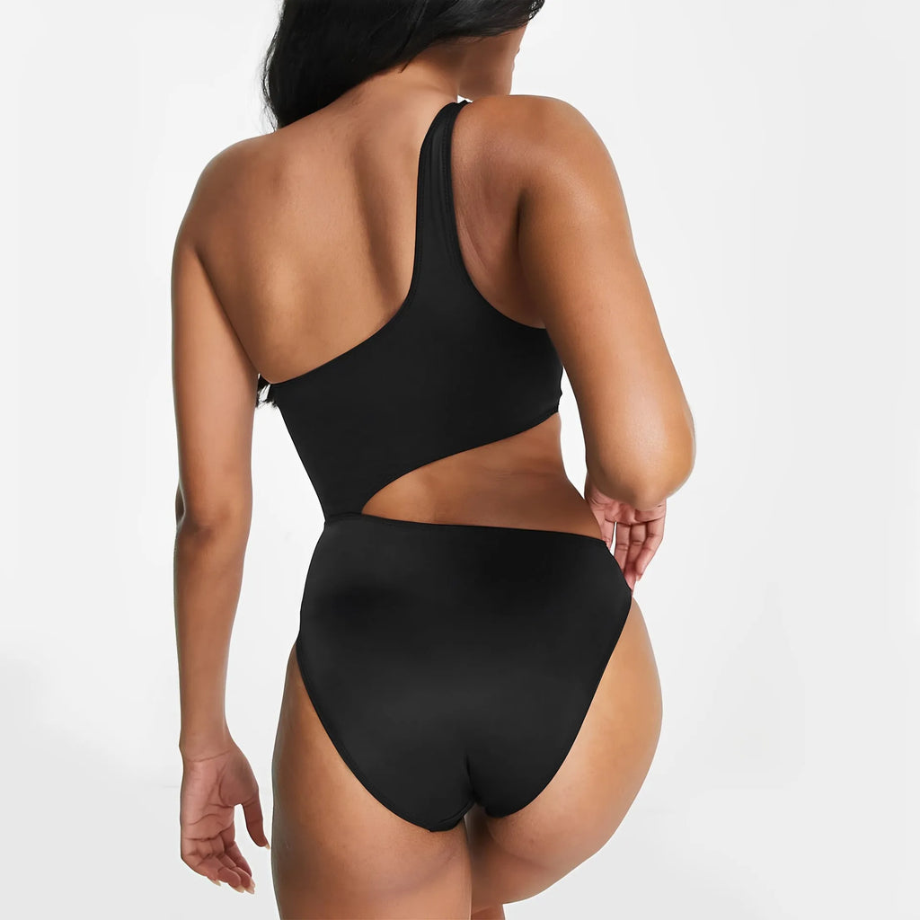 Black one-piece swimsuit with white contrast stitching and hollow cut-out details, front view, sleeveless design