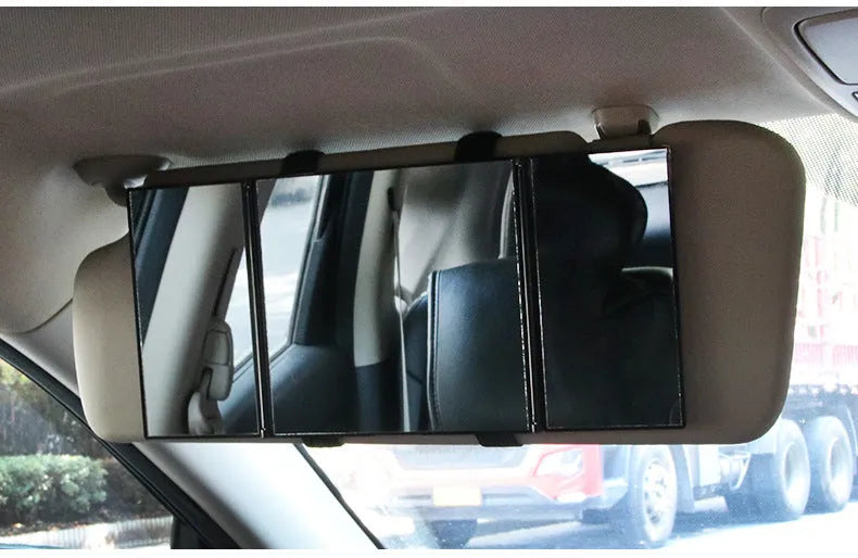 Silver folding car makeup mirror shown open and closed, next to a car visor.