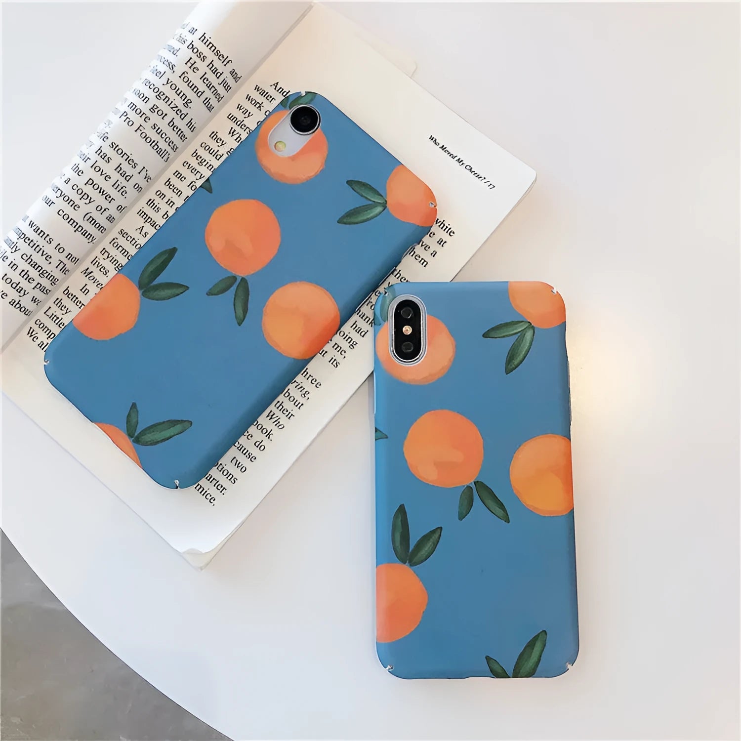 Orange retro plastic iPhone case with water and blue background design shown on smartphone