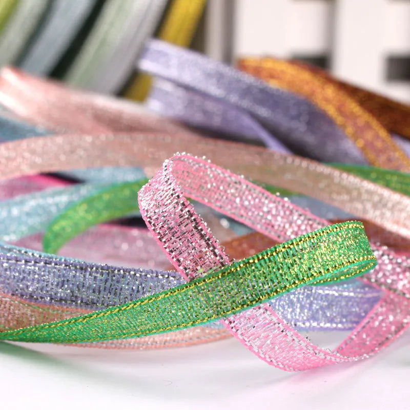 Roll of 0.6cm wide polyester gift ribbon in various colours including gold leaf, coffee and sky blue options