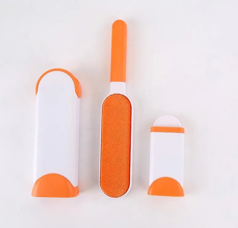 Blue reusable pet hair removal brush with a self-cleaning base, placed on a grey sofa.