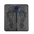 Leather foot massage cushion with LCD screen and wireless remote control on a floor