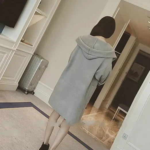 Plus size woman wearing a thin grey cotton coat with lace detail, loose fit, and long sleeves.