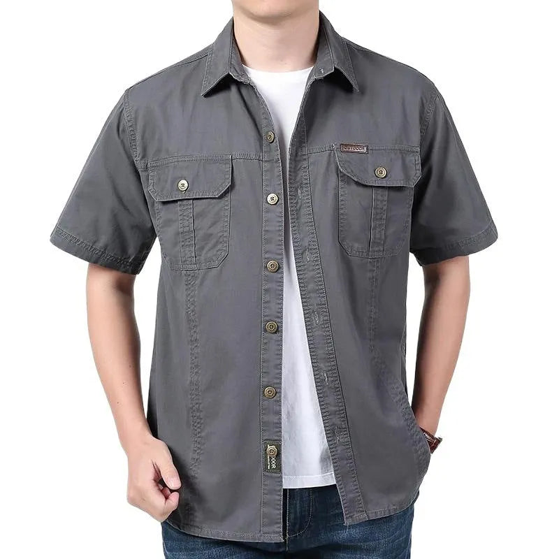 Men's cotton short sleeve loose fit cardigan shirt in dark blue on a model, summer workwear style