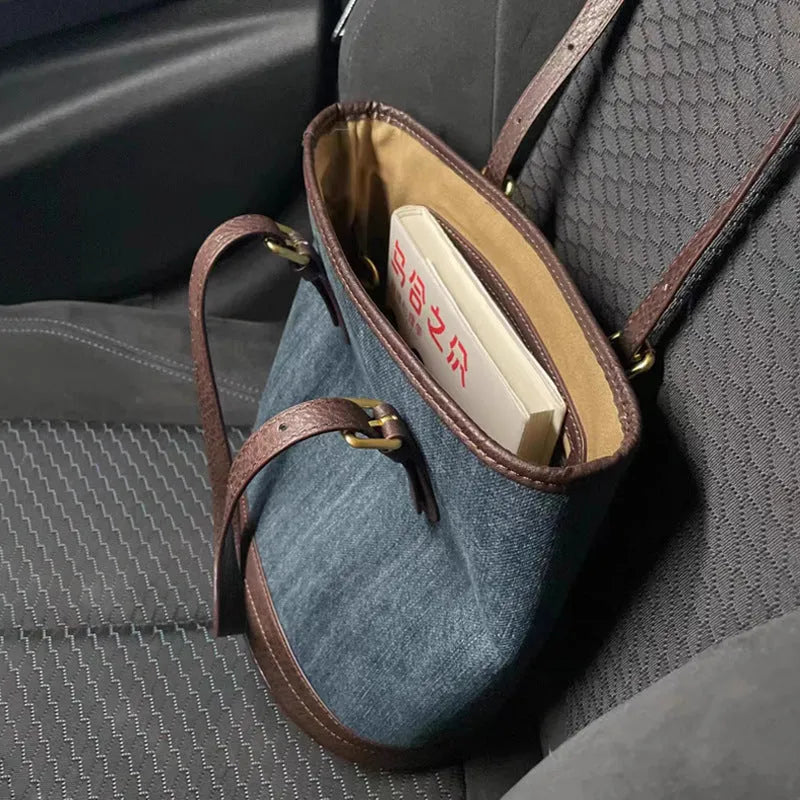 Denim patchwork one-shoulder bucket handbag showing dimensions and polyester construction