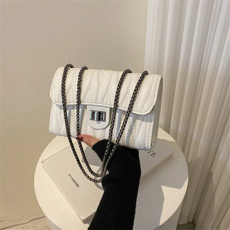 Retro textured diamond pattern small PU leather bag in a horizontal square shape, shown in beige colour.
