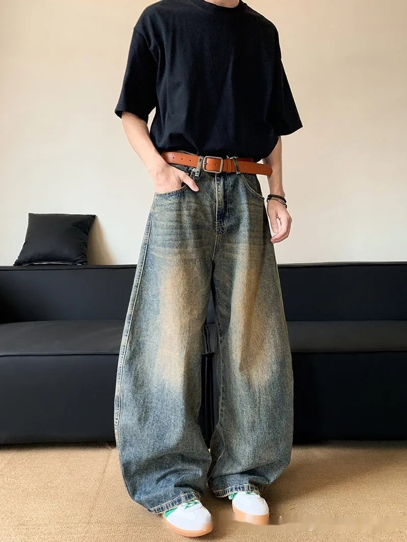 Men's retro blue distressed denim jeans with wide-leg silhouette and micro elasticity fabric