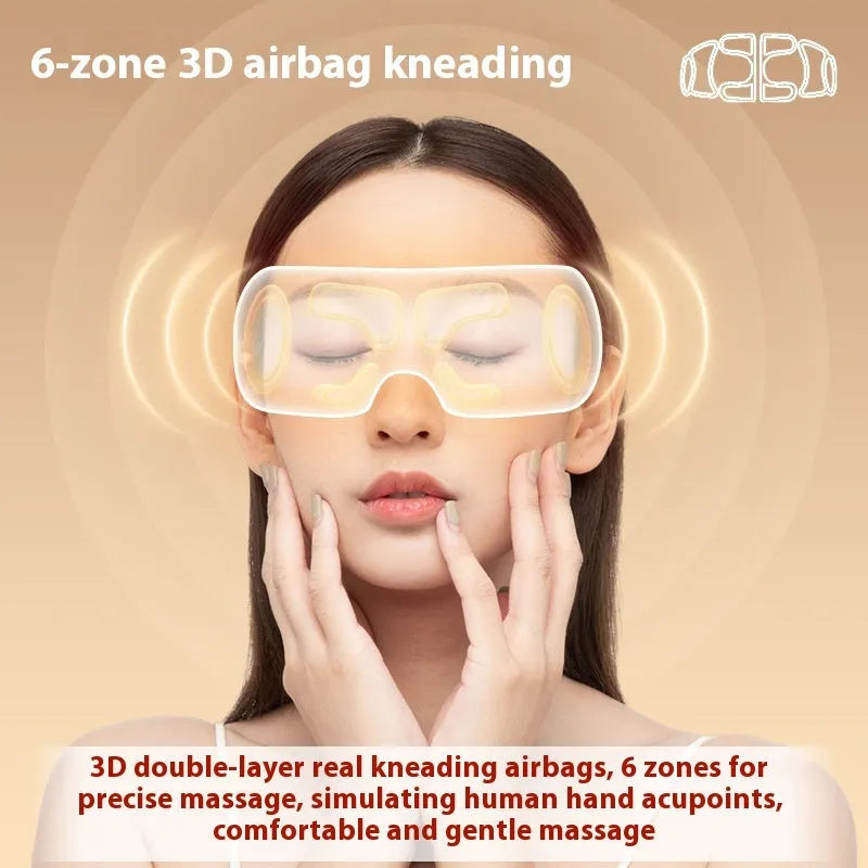 White rechargeable eye massager with heat and air compression therapy on a grey background.