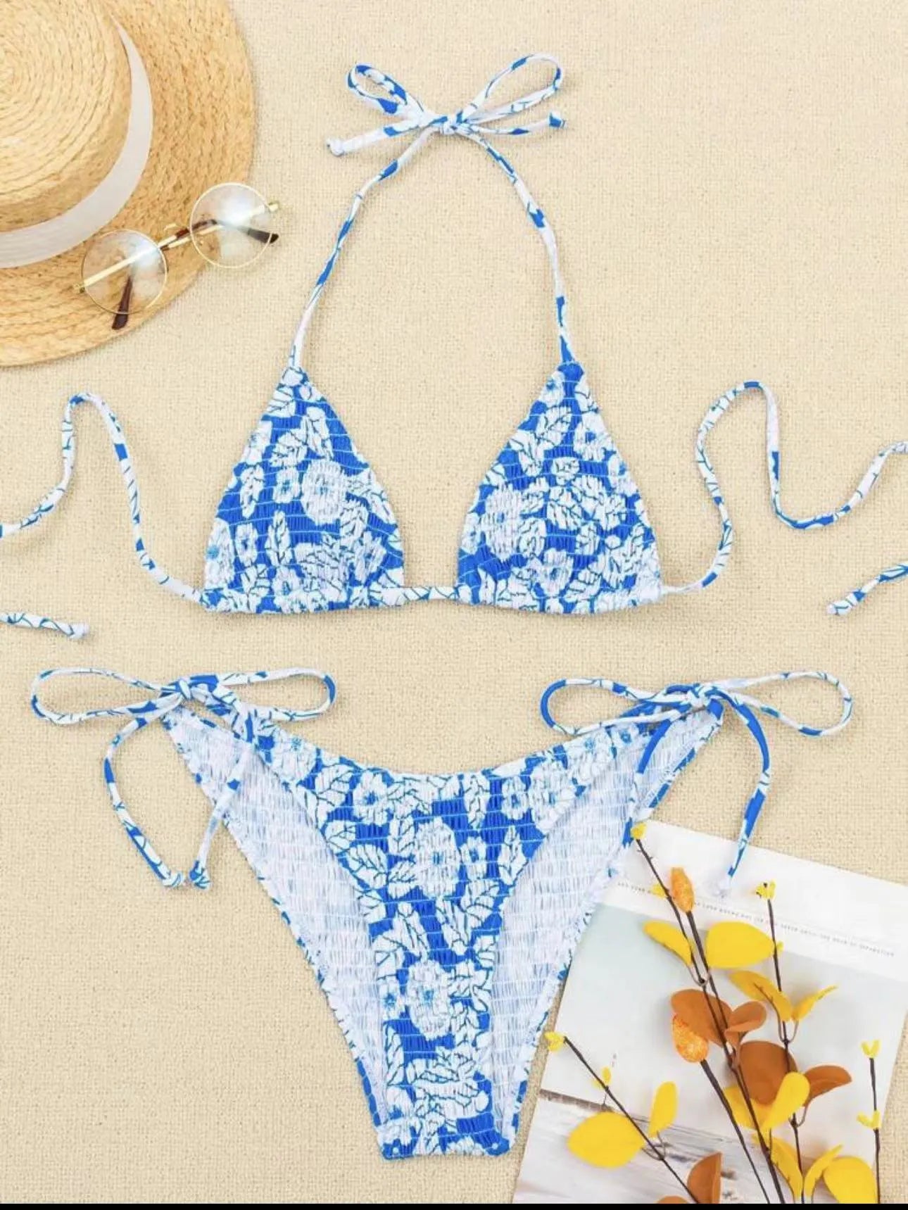 Women's floral halter neck swimsuit briefs in light blue on a mannequin