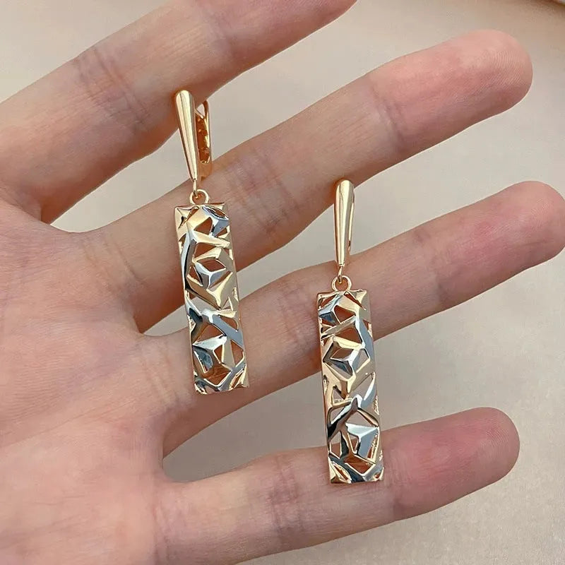 Rectangular two-tone hollow stud earrings with geometric shape and electroplated finish