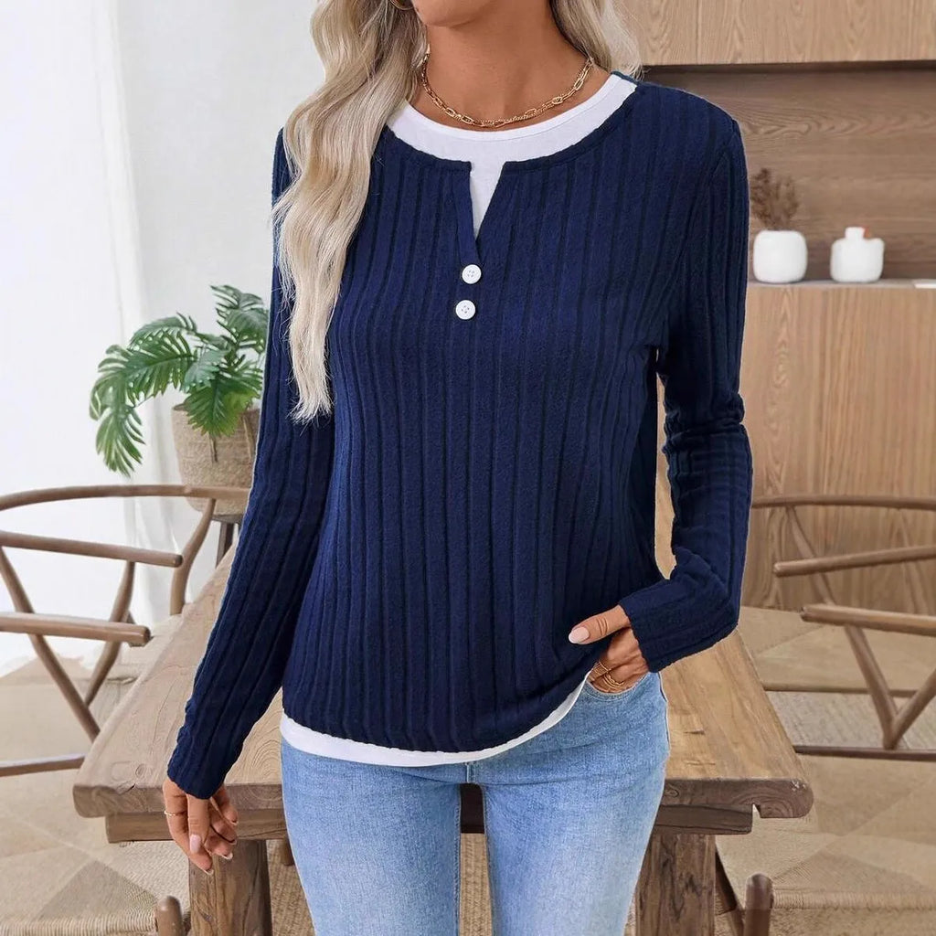 Women's black fake two-piece round neck pullover sweater with long sleeves.