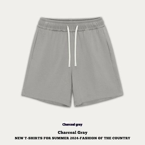 Baby boy and girl wearing loose-fitting cotton denim shorts in cream apricot colour.