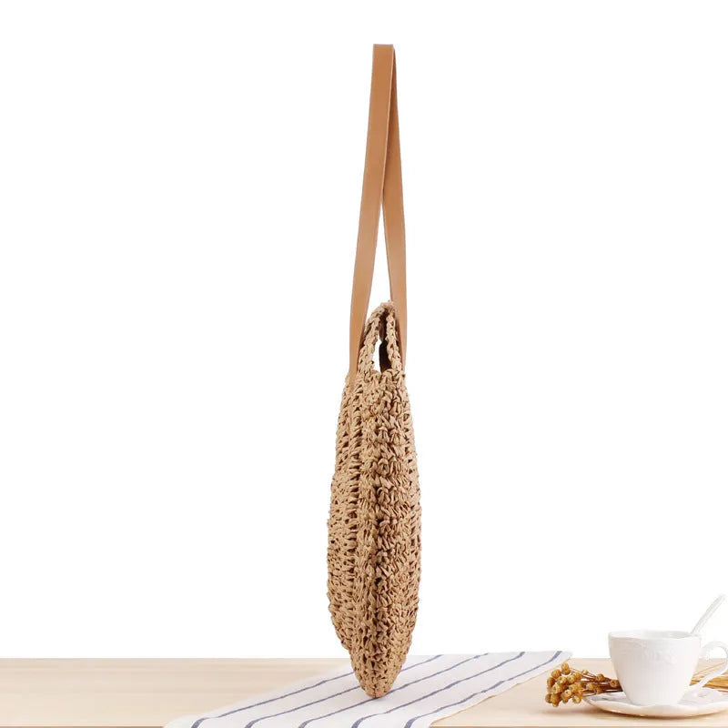 Medium beige straw round shoulder bag with woven finish and zip closure