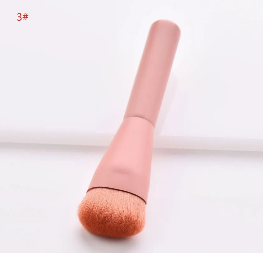 Ten makeup brushes with wooden handles arranged showing different brush head types including powder, foundation and double-headed tools