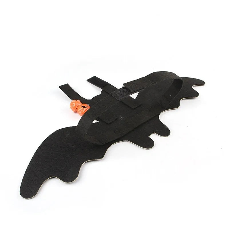 Halloween batwing costume for a cat or small dog made from orange and black felt.