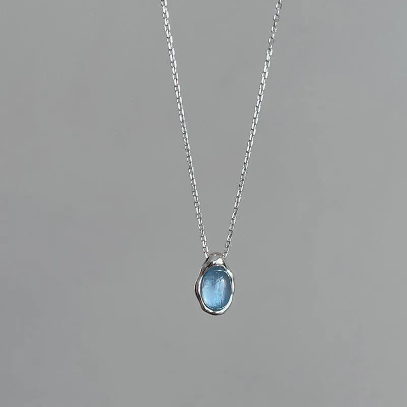 Navy blue geometric water drop pendant necklace with platinum-plated finish on adjustable chain
