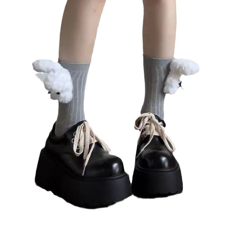 Black women's lace-up platform shoes with a chunky rubber sole and English muffin heel.