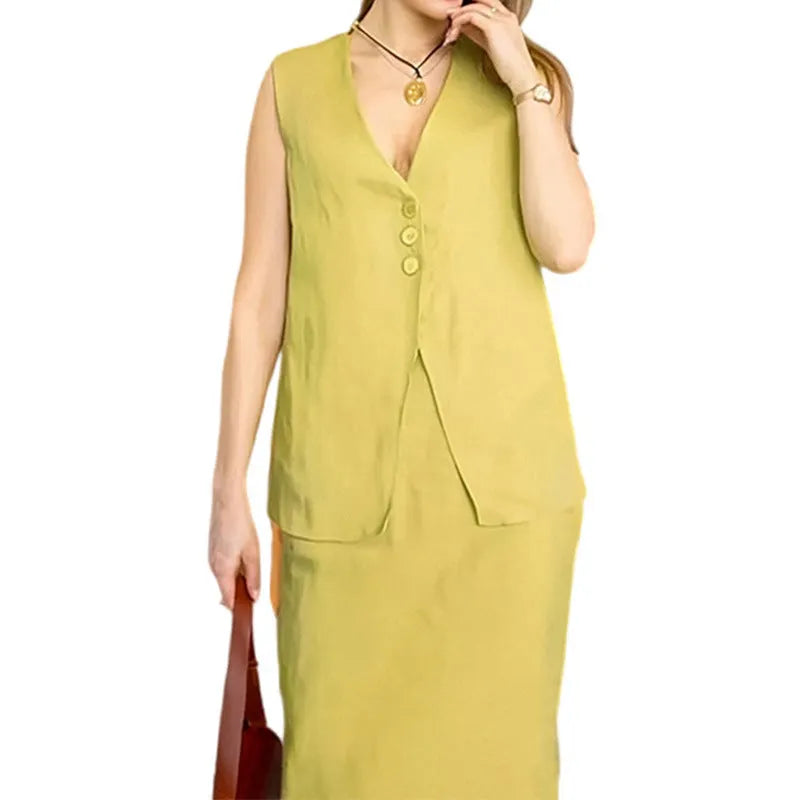 Women's loose fit blue polyester two-piece suit with sleeveless vest and long skirt.