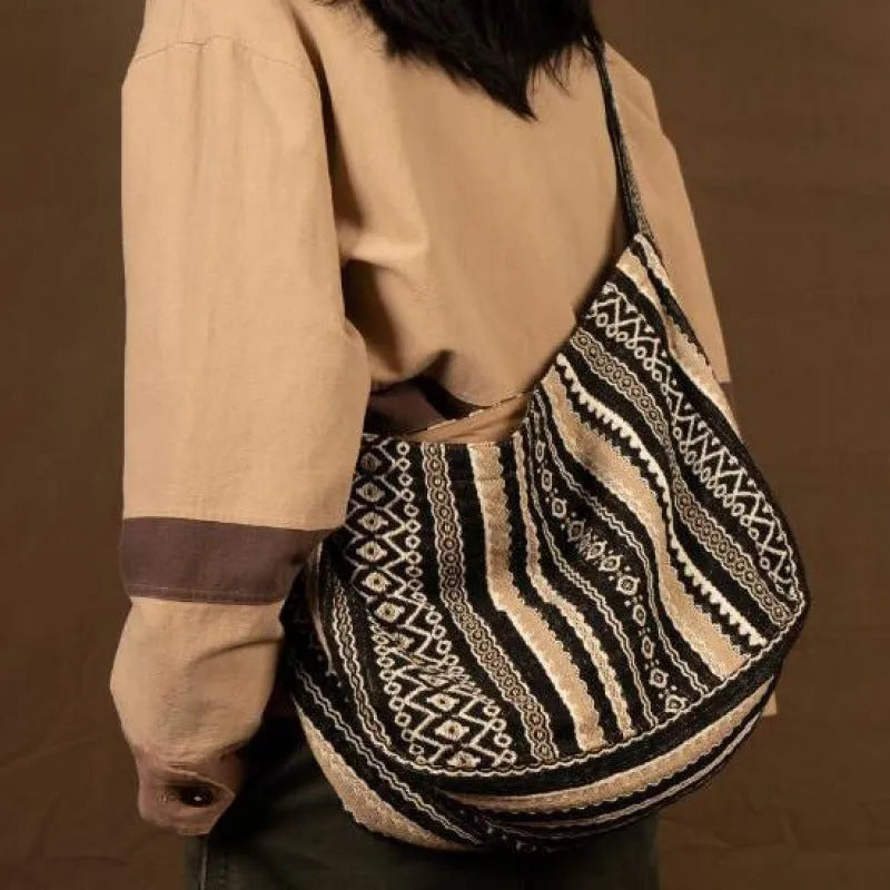 Retro striped corduroy messenger bag with vintage handprint detailing and adjustable plaid shoulder strap