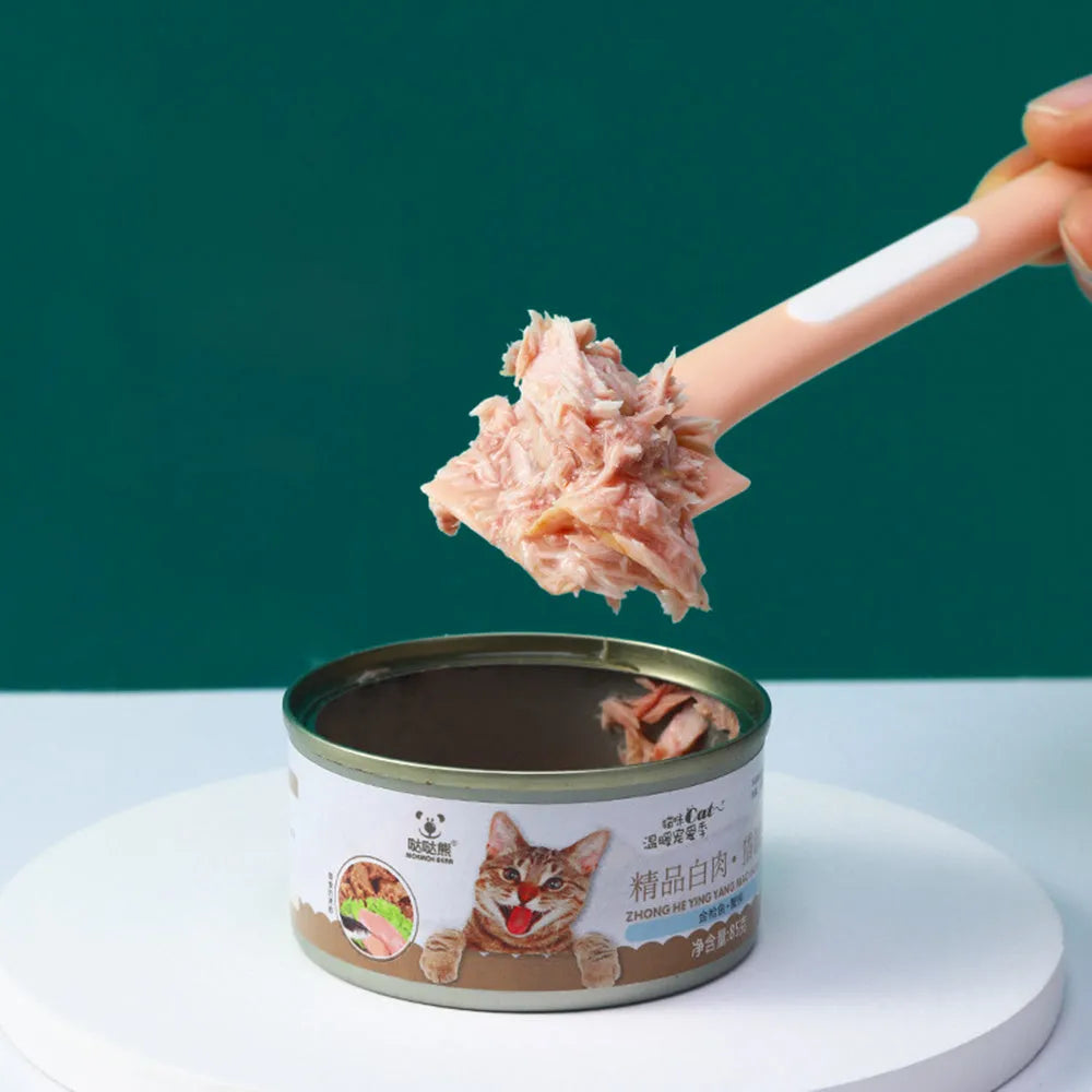 Long green TPR pet food spoon with right-angle head for feeding from tins