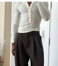 Men's cream ribbed long-sleeve henley top with three-button placket in apricot colour