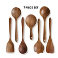 Seven-piece wooden kitchen utensils set with spoons and spatulas for cooking and serving