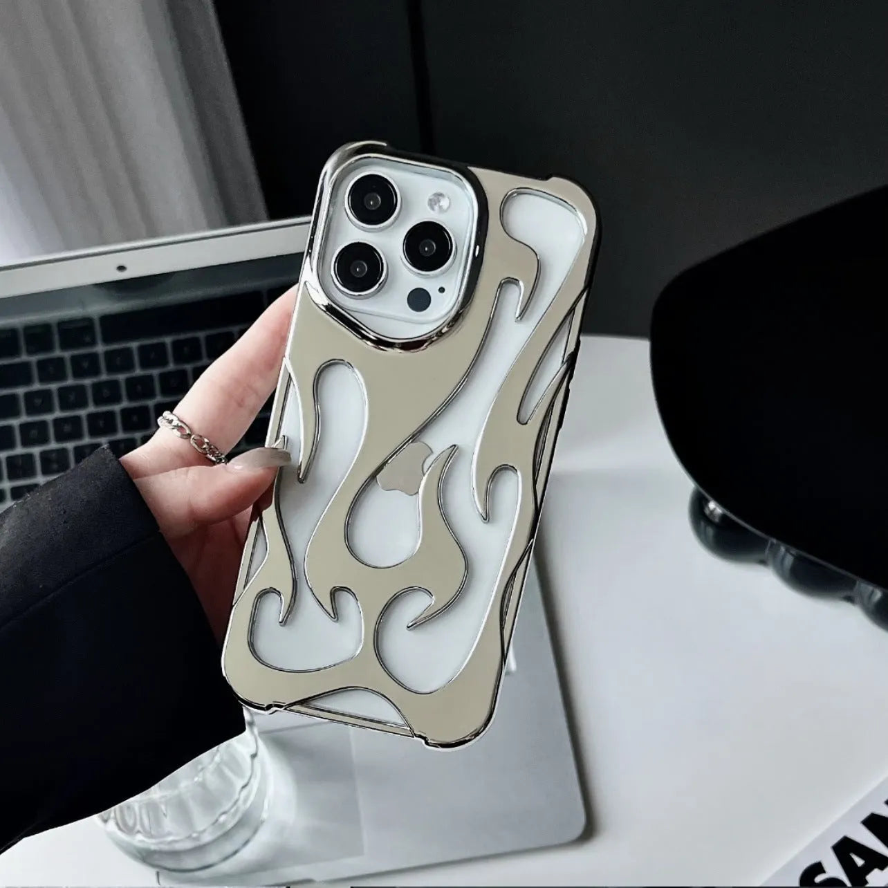 Electroplated hollow flame pattern iPhone case in silver with TPU soft shell construction