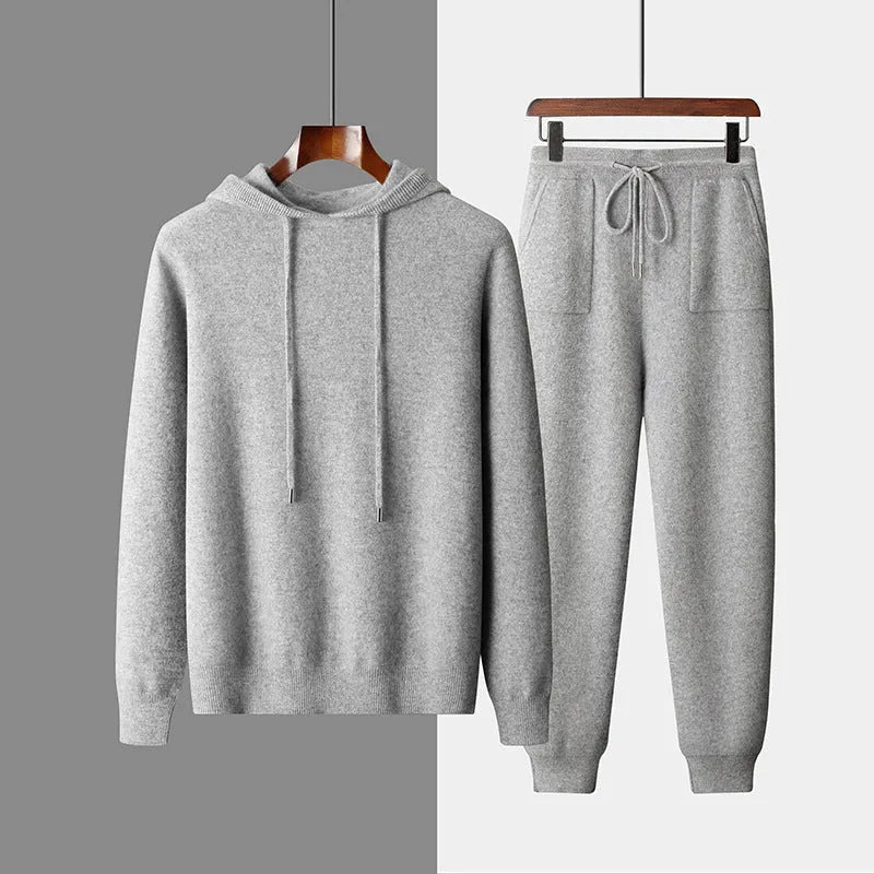 Men's light gray hooded cashmere sweatshirt and matching trousers laid flat as a set.