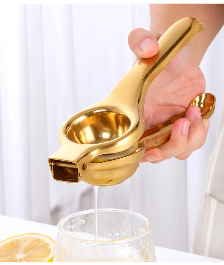 Manual stainless steel citrus juicer with hand press and round feed opening available in multiple colours
