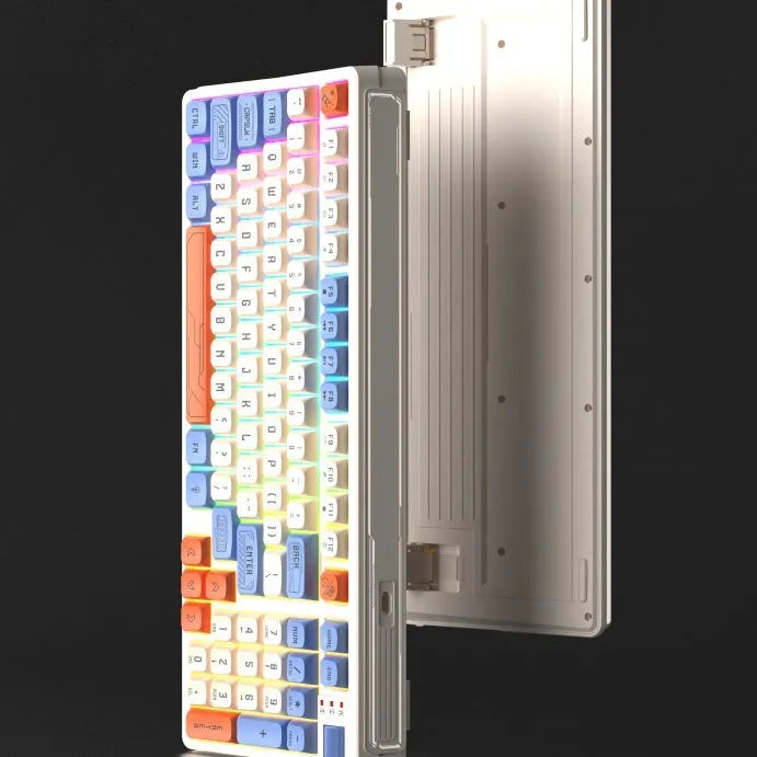 Luminous plastic computer keyboard in one of four colour combinations on a desktop.