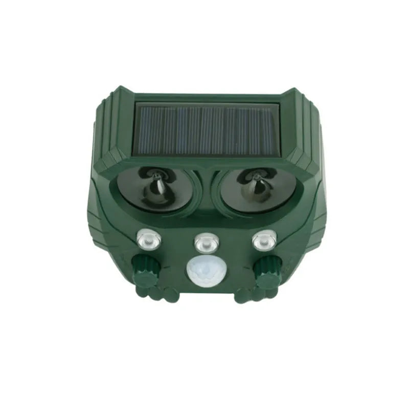 Green solar ultrasonic animal repellent with solar panel showing 12x13x5cm dimensions