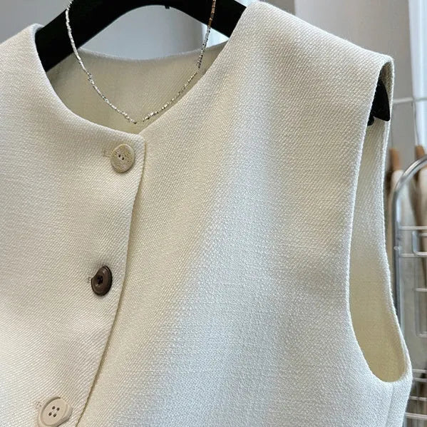 Women's round neck sleeveless vest in polyester with French bandage style, shown in milky white and black colours