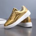 Rose gold platform sneaker with sequin details and a thick, light-coloured sole.