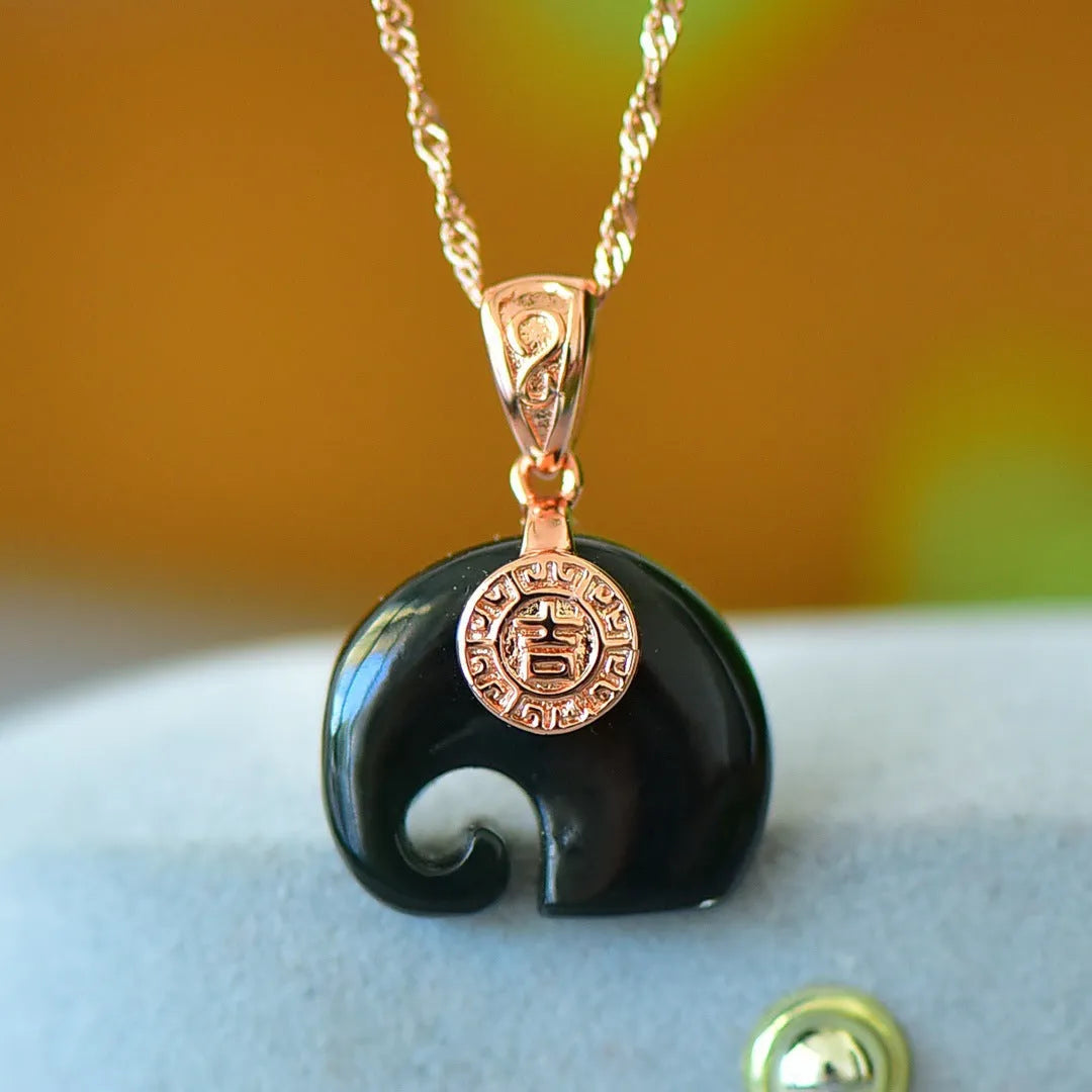 Flat grey Hetian Jade pendant with copper inlay and blue jadeware detail on a silver chain.