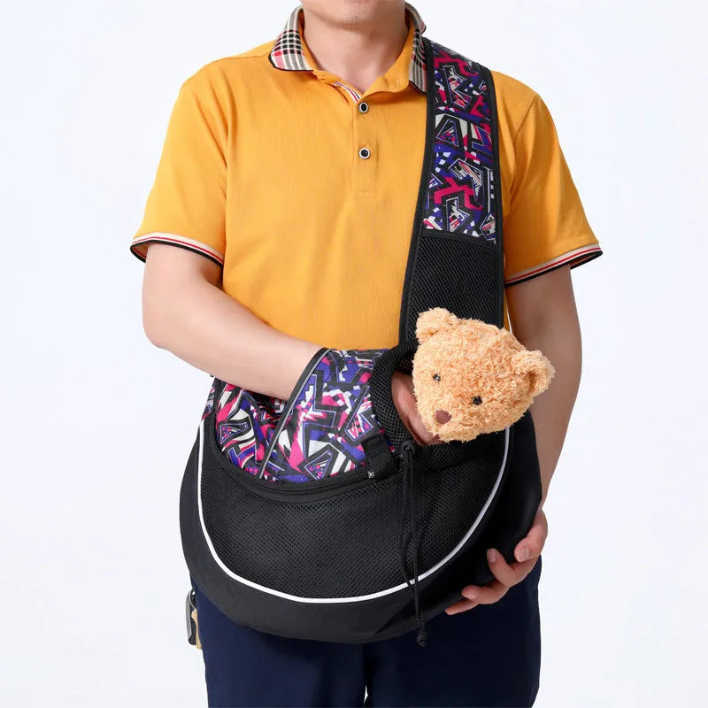 Women carrying black pet crossbody bag with small dog inside, Oxford material with drawstring closure