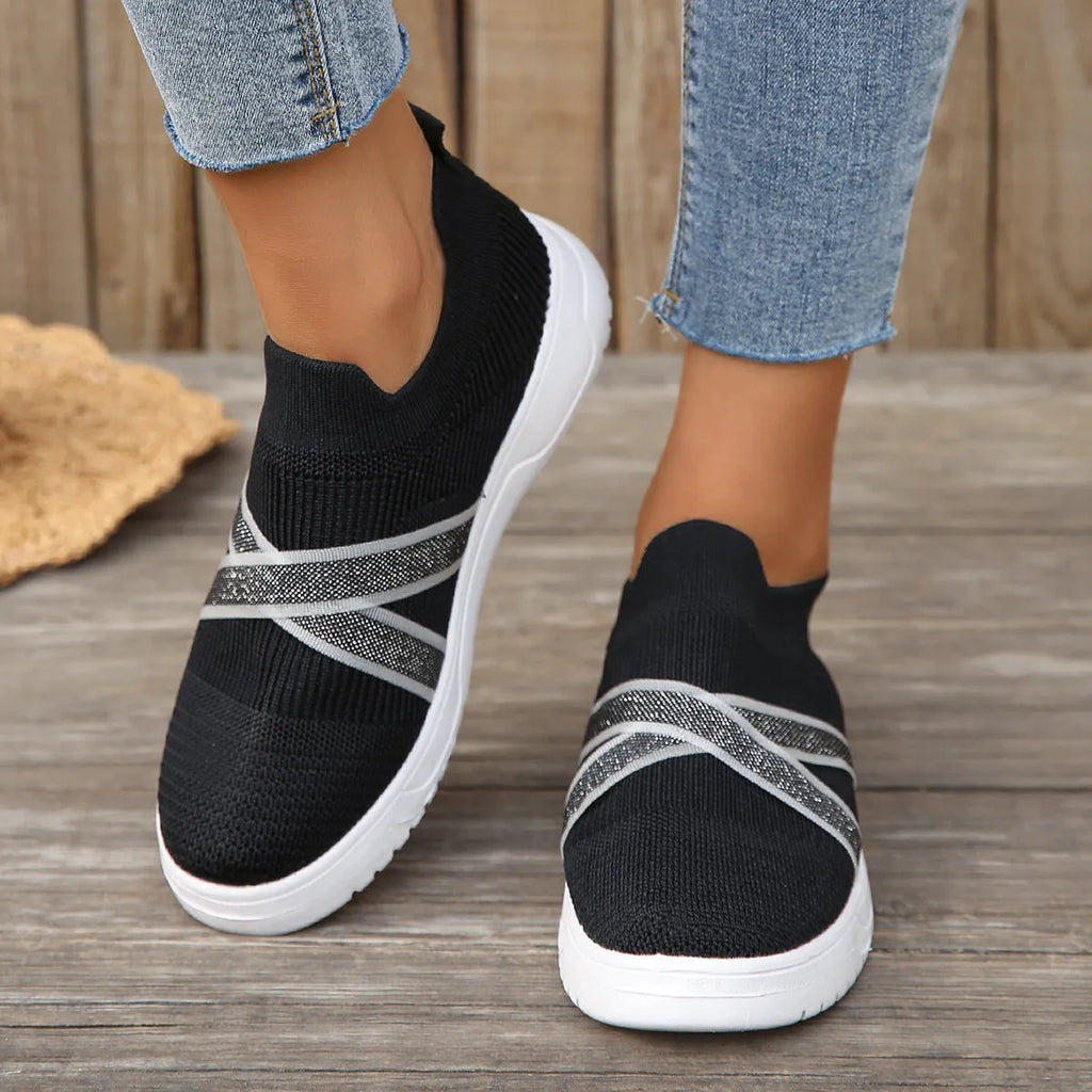 Black women's flat mesh shoes with flyknit fabric upper and tassel detail