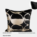 Black gold abstract pattern decorative flannel cushion on a sofa, showing removable cover.