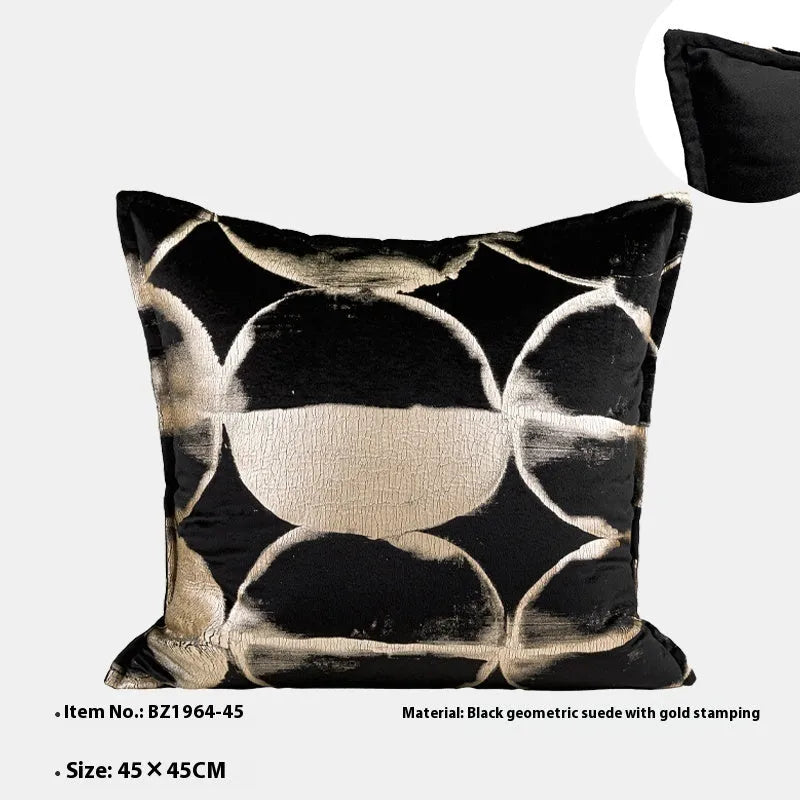 Black gold abstract pattern decorative flannel cushion on a sofa, showing removable cover.