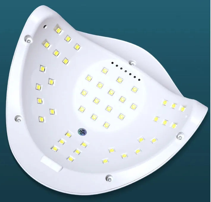 White nail drying lamp with UV and LED lights showing digital timer display