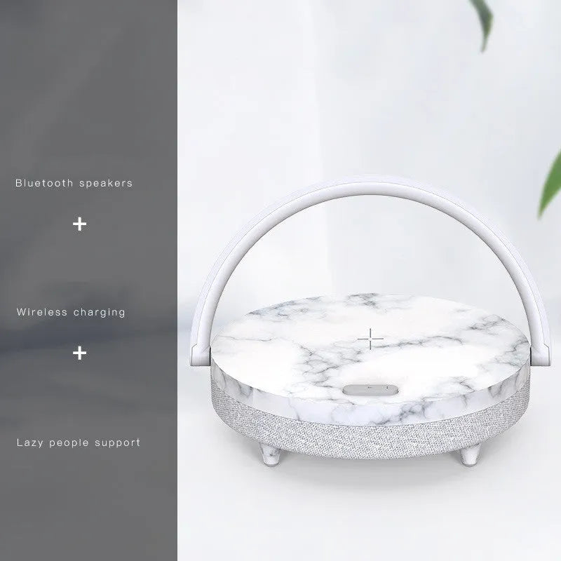 Wireless charging LED night light with Bluetooth speaker and phone holder in compact bedside design
