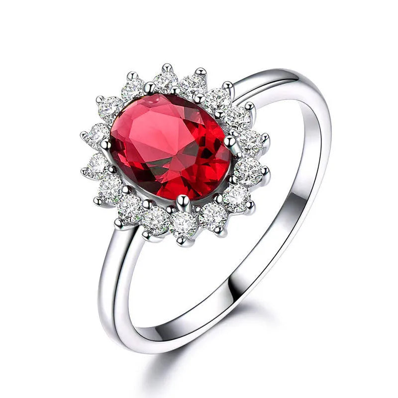 Women's blue moissanite and copper floral ring on a finger, showing zirconium inlay and electroplated colour.