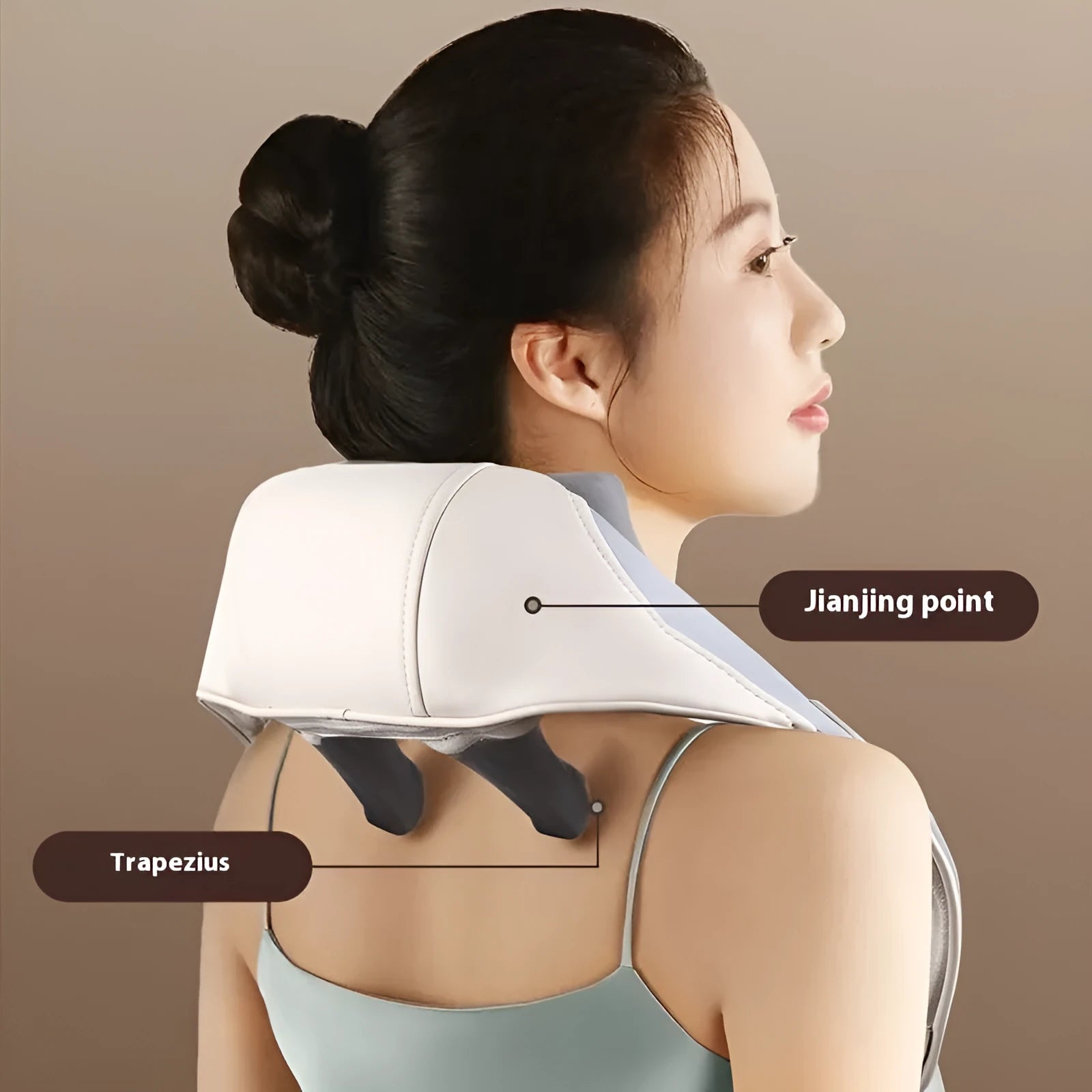 Blue foldable electric neck and back massager with rechargeable battery on a table.