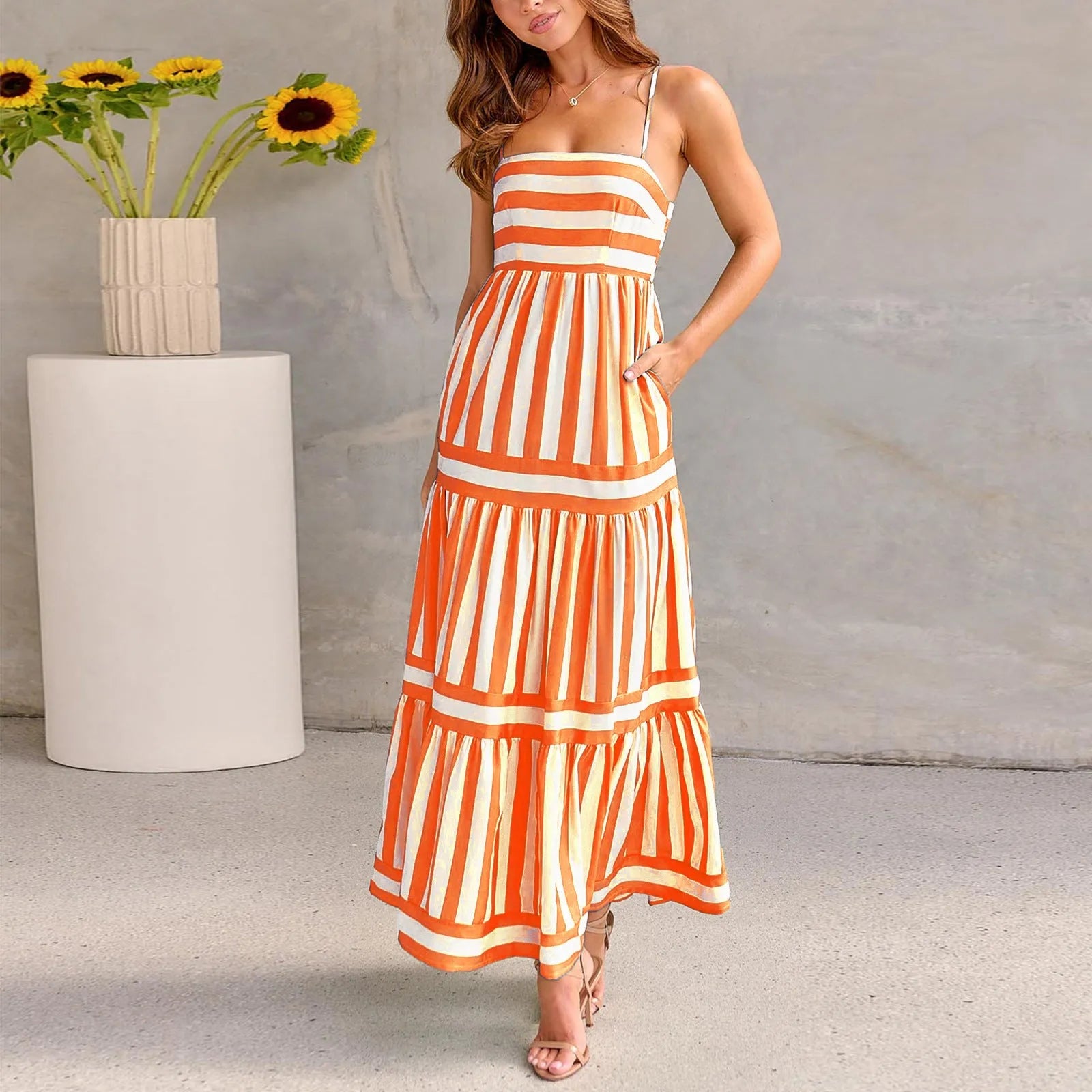 Women's striped printed summer dress with suspender straps and side pockets in blue colour