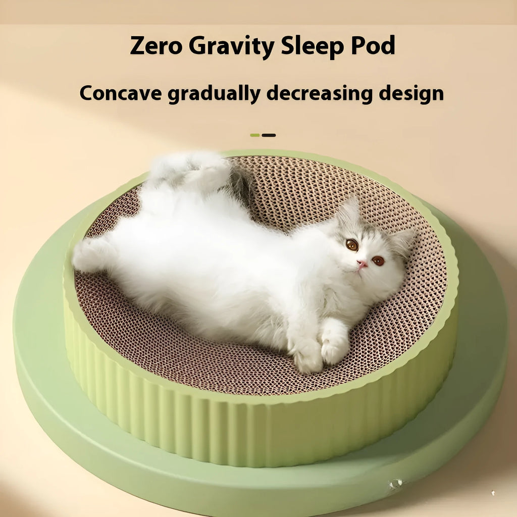 Green and white round cat scratching board with replaceable corrugated cardboard panels.