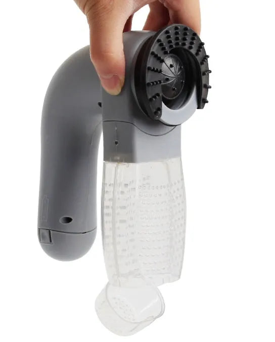 Grey cordless handheld pet hair vacuum grooming brush with soft rubber head